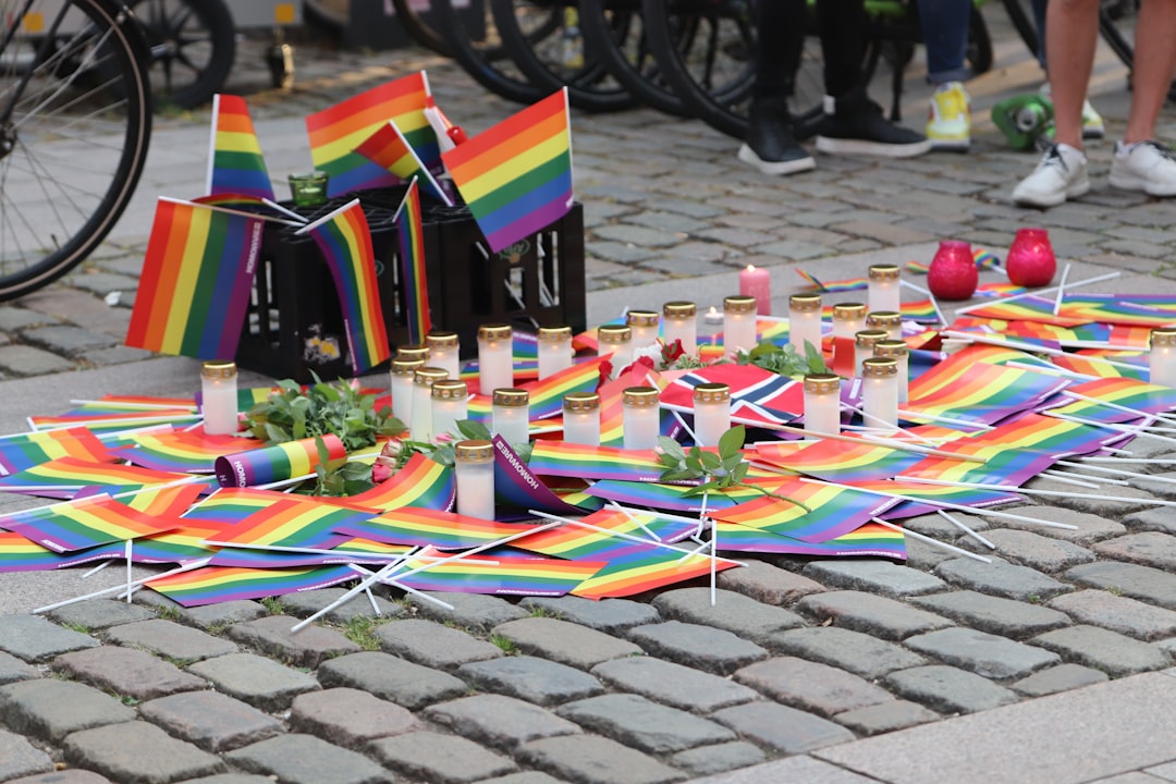 a group of colorful objects on a brick surface, Support for the victims in Norway