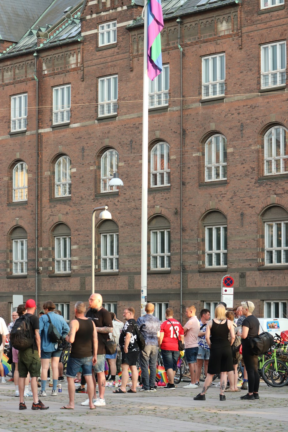 a group of people standing in front of a brick building with Merseyside Maritime Museum in the background