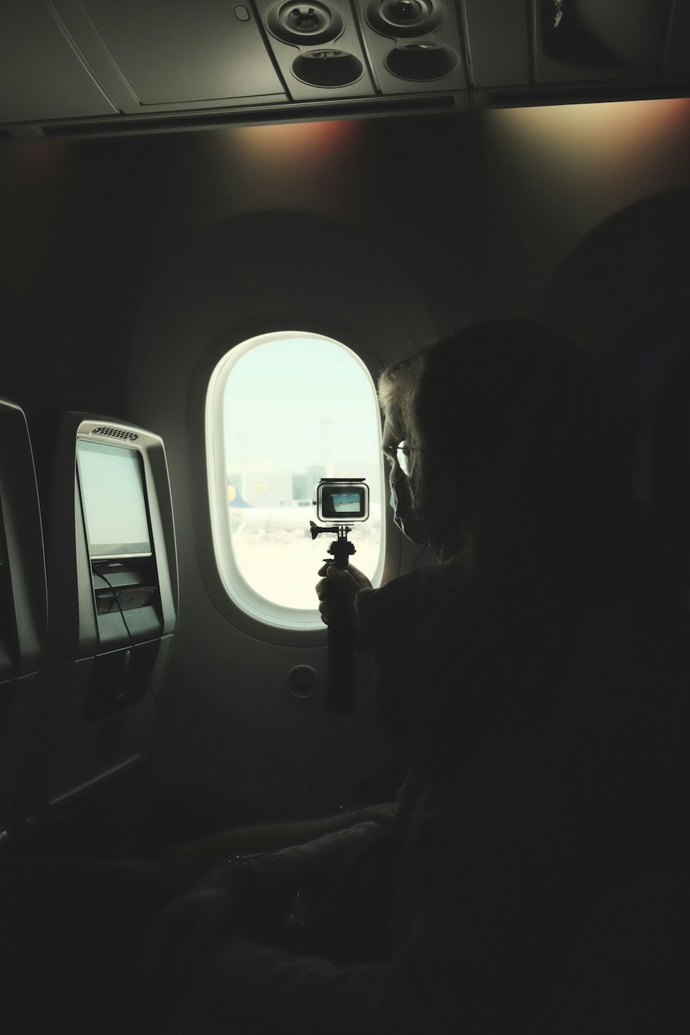 a person takes a picture of a plane