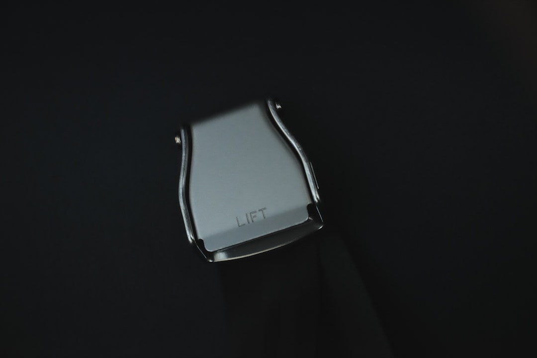 a silver ring with a black background,