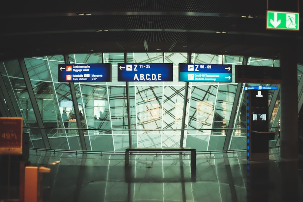 a glass building with signs