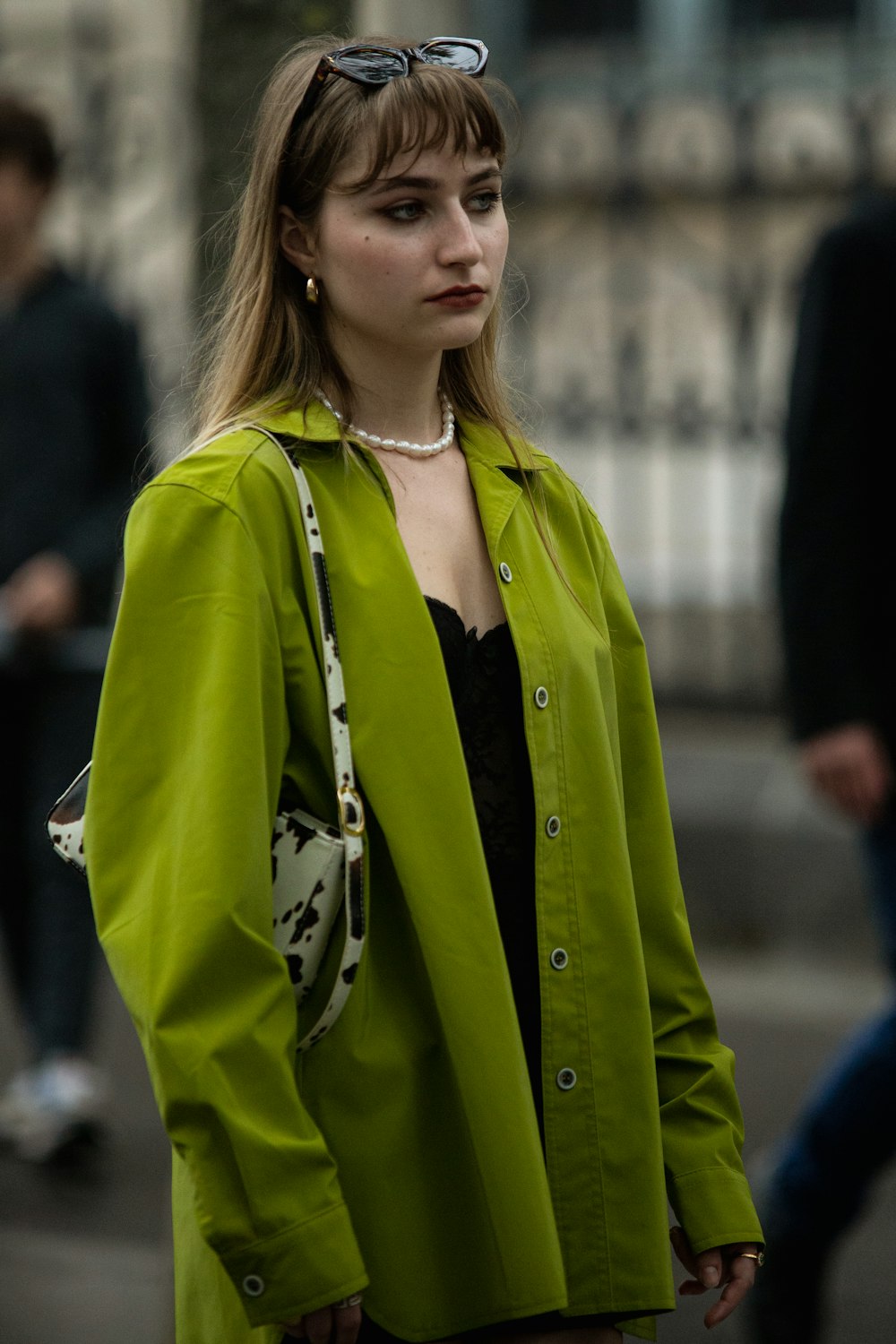 a woman in a green coat