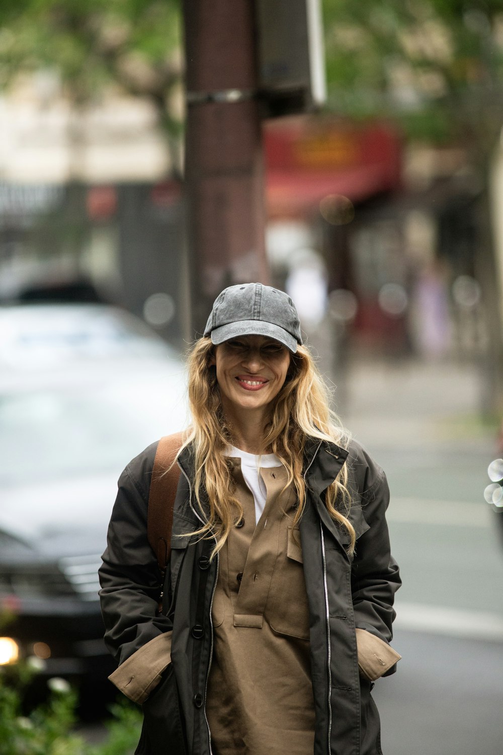 a woman wearing a hat and coat