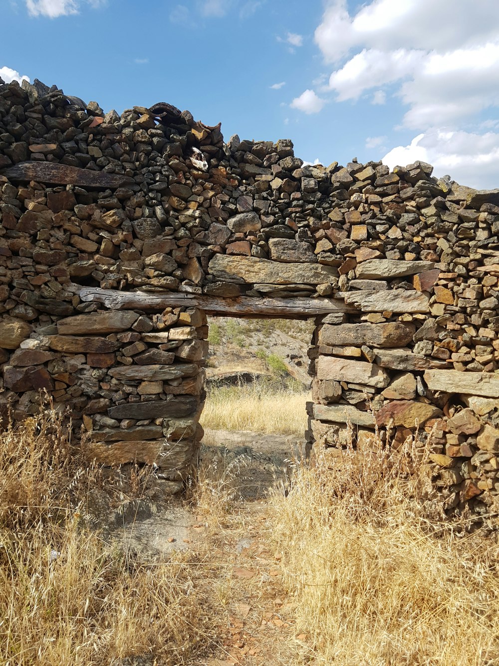 a stone wall with a stone fence