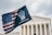 A flag design blending the American flag with text forming a raised fist is prominently displayed in front of a neoclassical building with large columns and ornate architectural details.