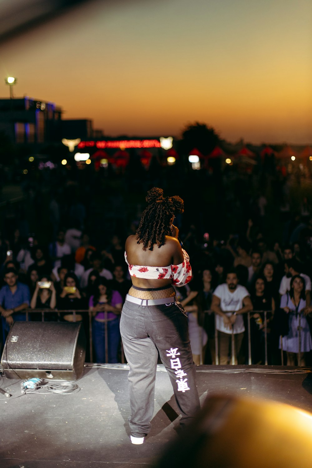 a person with a crowd watching