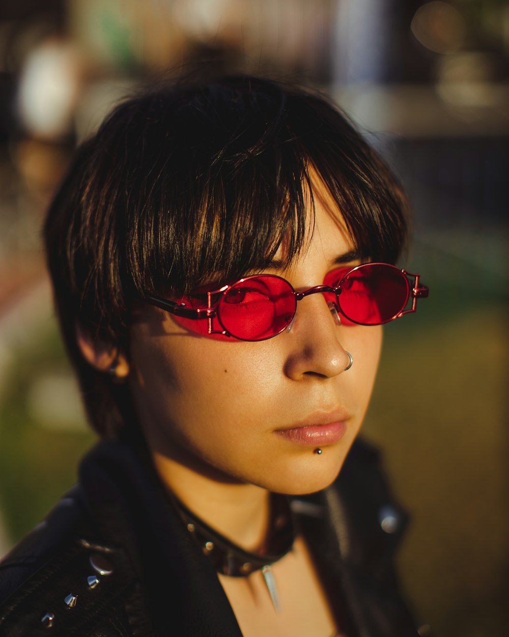a woman wearing red sunglasses