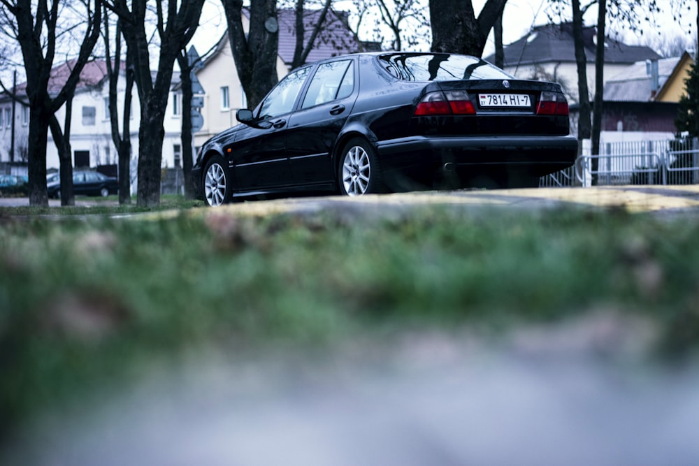 a black car parked on a street