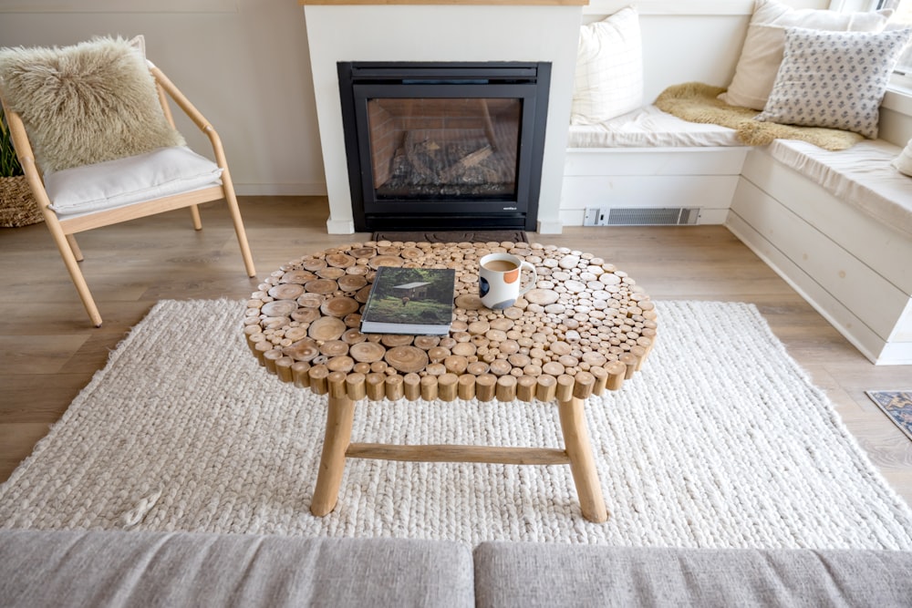 a coffee table with a book and a coffee cup on it