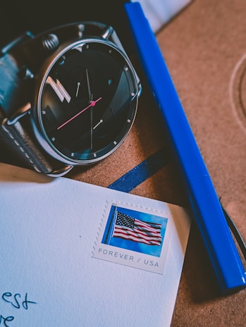 Close-up of a stopwatch and parcel to symbolize fast delivery service.