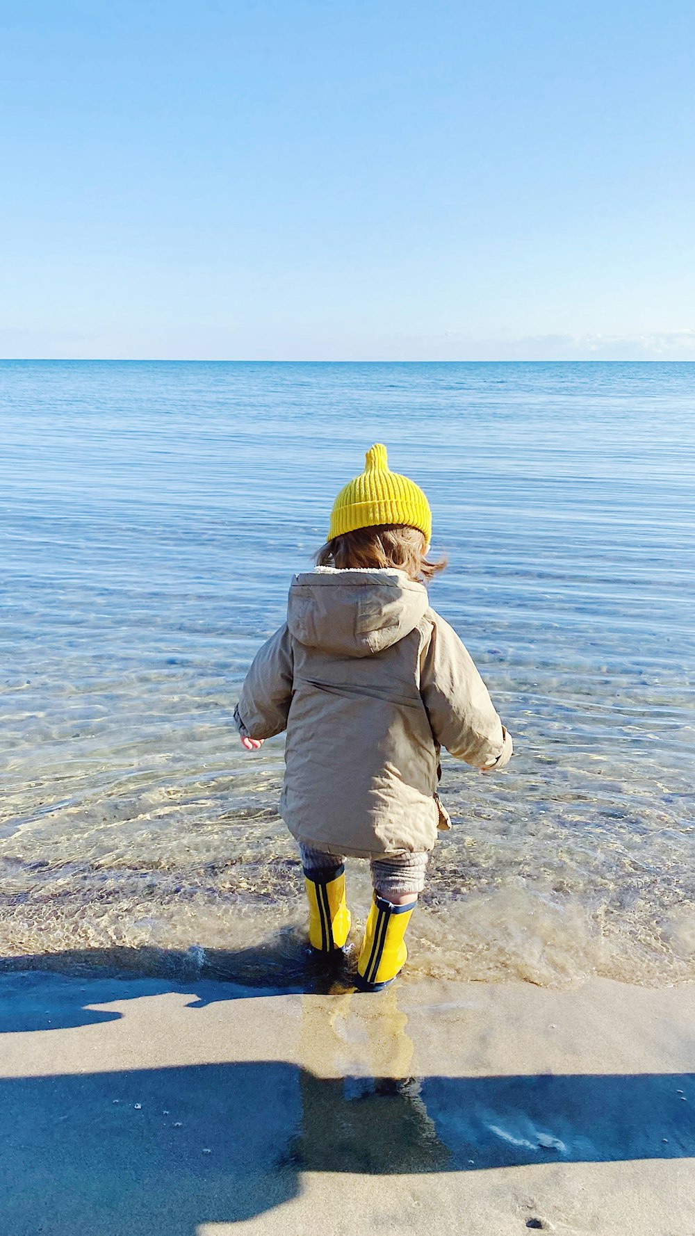 a child walking on a beach