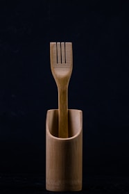 Close-up of bamboo forks and knives in a stylish eco-friendly box.