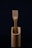 A wooden fork is elegantly placed inside a matching wooden container. The background is dark, emphasizing the natural texture and simplicity of the design.