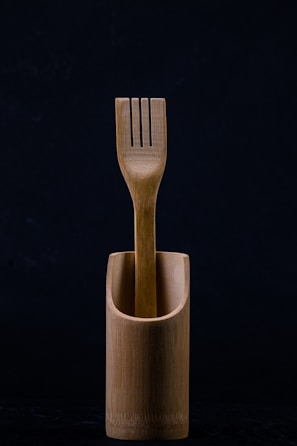 Elegant bamboo cutlery sets packaged in eco-friendly boxes, ready for gifting.