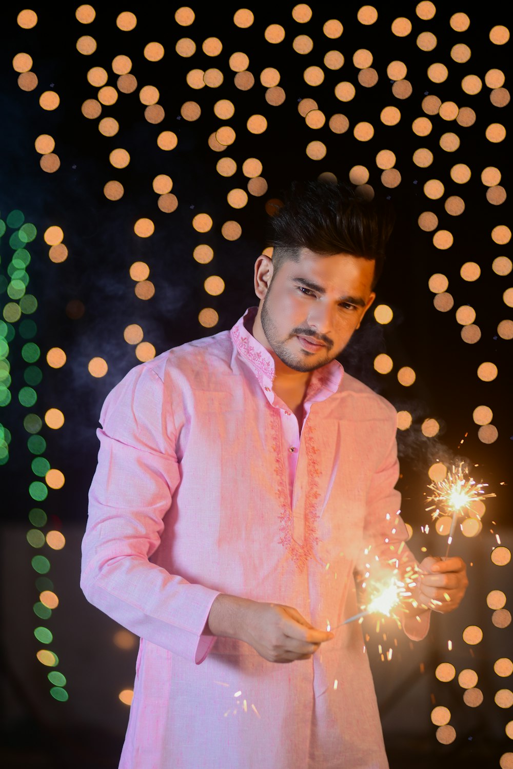 a person holding a sparkler