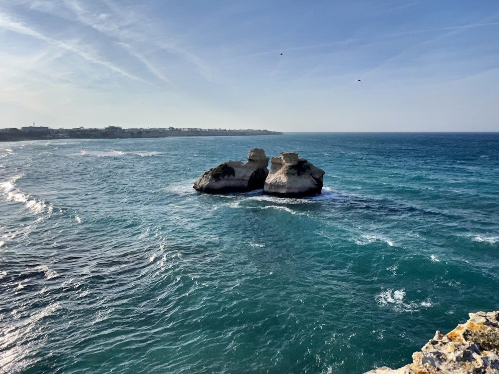 a body of water with rocks in it