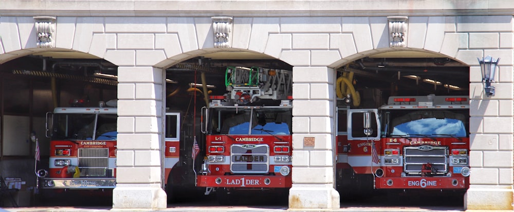 a group of fire trucks parked in a garage