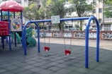 a playground with blue and red bars
