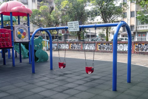 a playground with blue and red bars