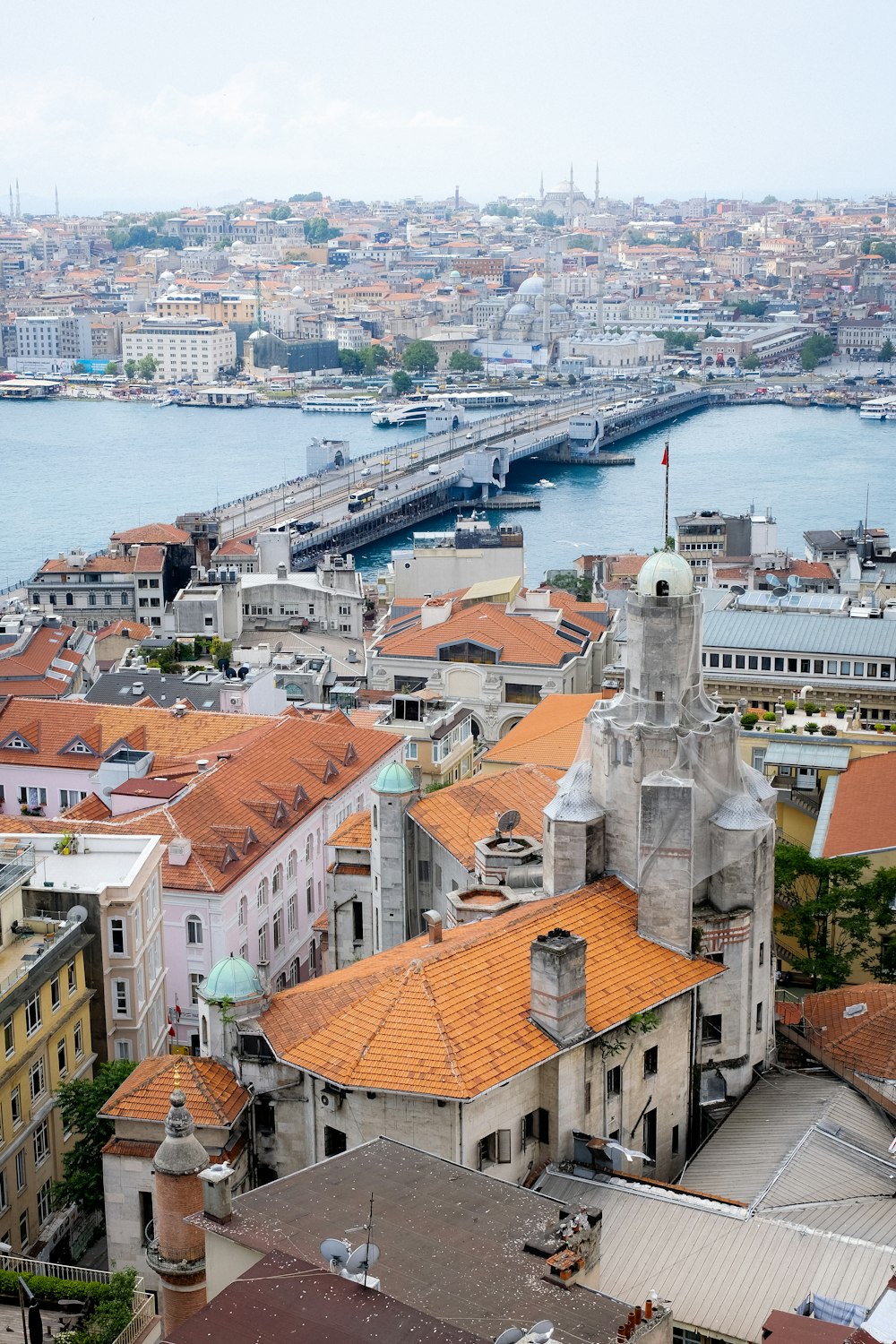 a city with a body of water in the background