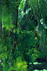 Abstract digital composition blending deep moss green and neutral shades.