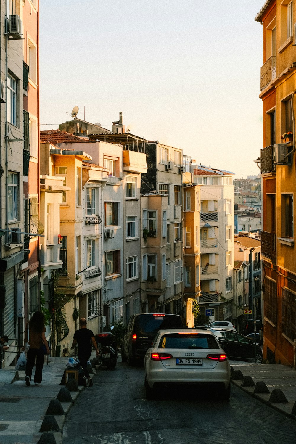 a street with cars and people on it