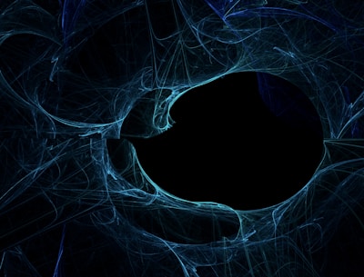 A mesmerizing abstract design featuring swirling blue lines and shapes converging around a dark, central void. The intricate patterns and textures suggest a sense of movement and depth, evoking a mixture of chaos and symmetry.