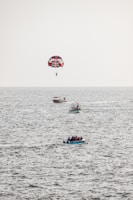 a person parasailing on a boat