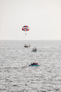 a person parasailing on a boat