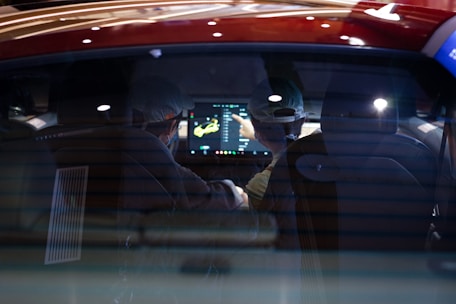 a couple of people in a car