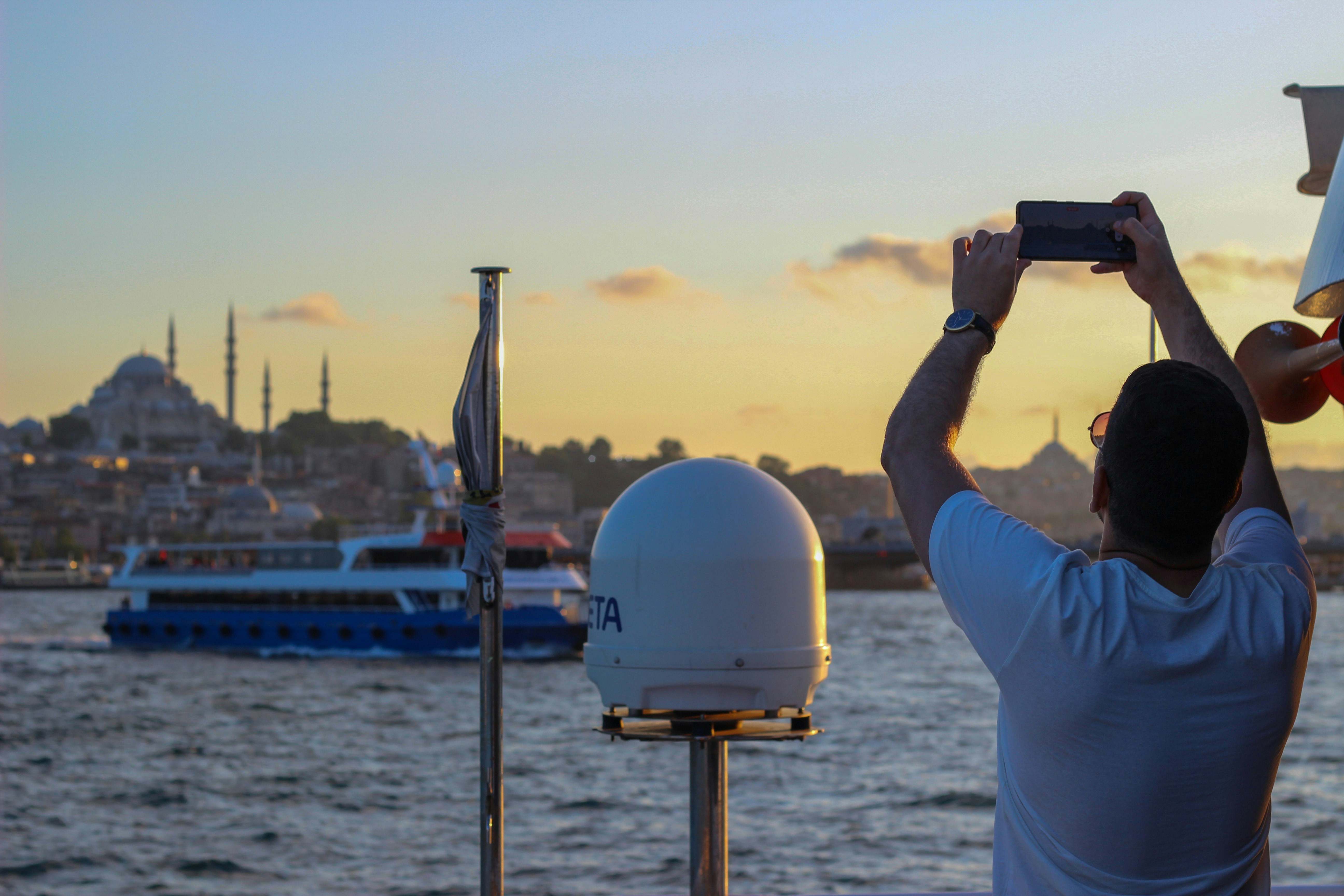 Traveler using a phone near the water in Istanbul