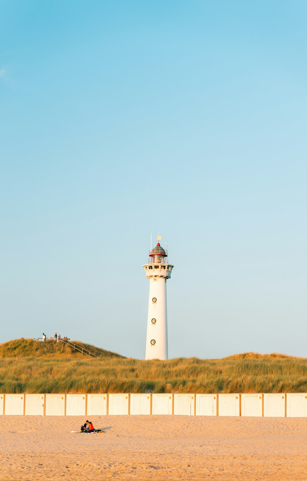 a lighthouse on a hill