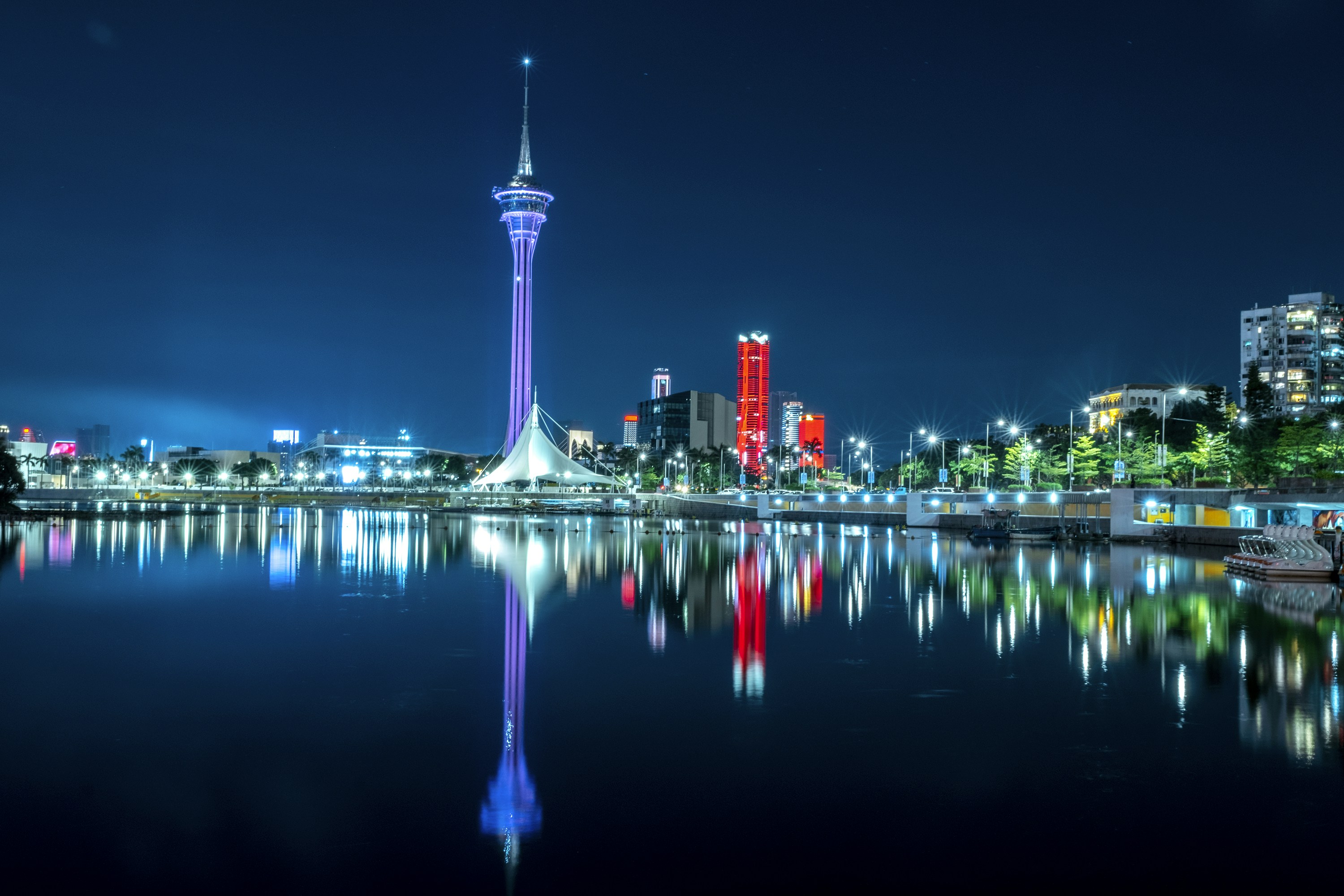 a body of water with a city in the background