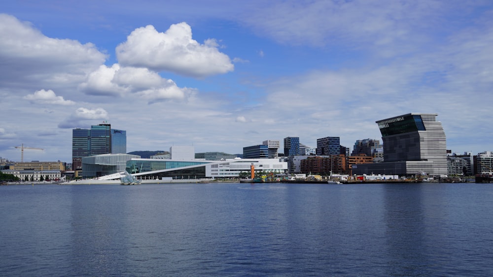 a body of water with buildings in the background