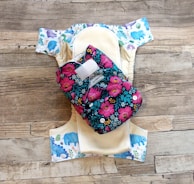 A close-up of eco-friendly baby bibs in pastel colors.