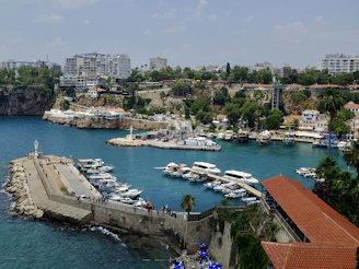 a body of water with boats in it and buildings around it