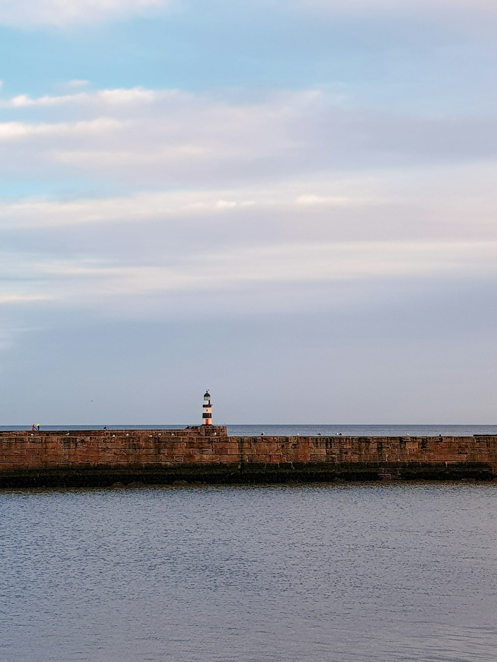 a lighthouse on a pier
