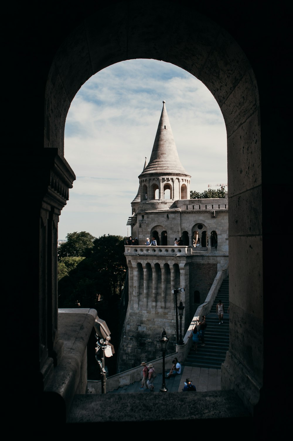 a view through a window of a building with a steeple