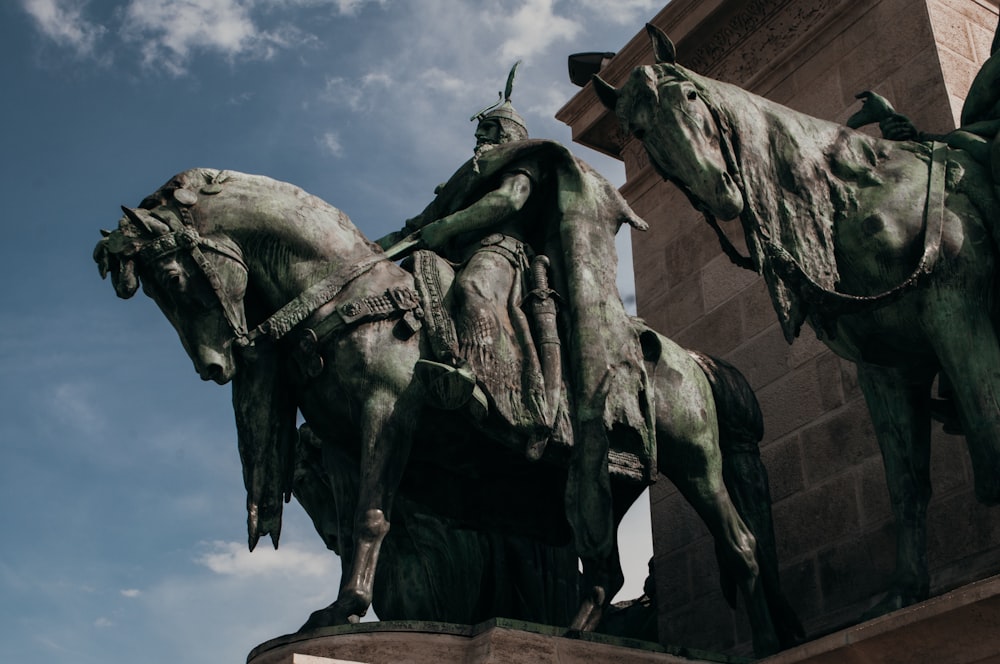 a statue of a person riding a horse