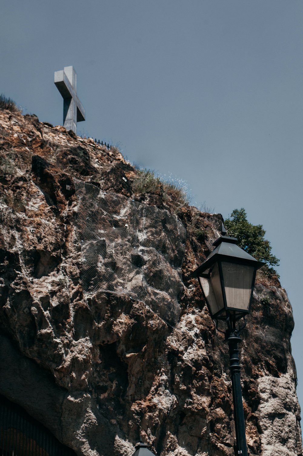 a lamp post on a rocky cliff