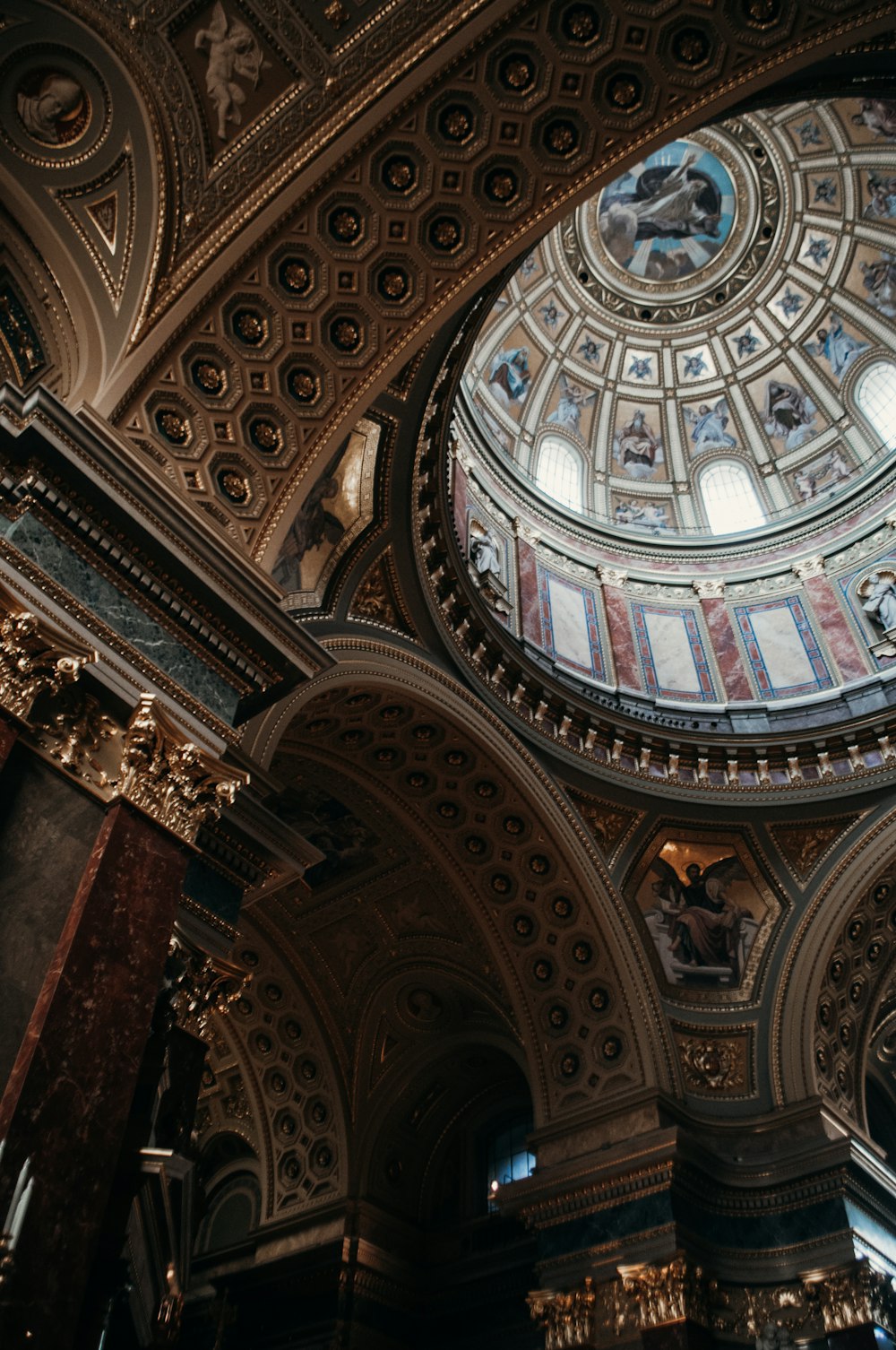 a large ornate ceiling with paintings