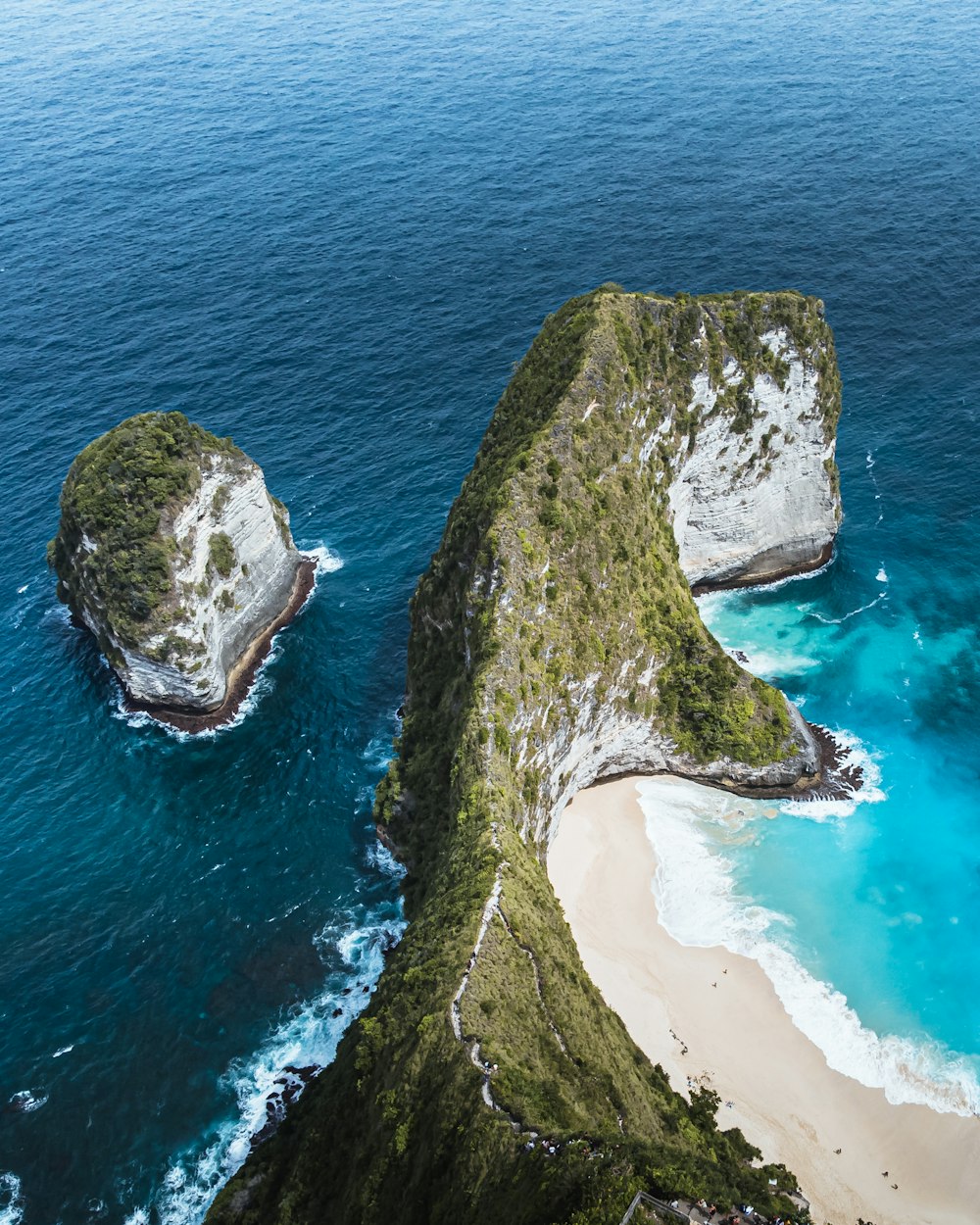 a group of large rocks in the water