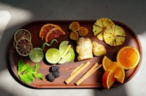 Close-up of fresh dried fruits and herbal teas arranged on rustic wooden trays.