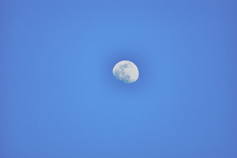 a moon in a blue sky