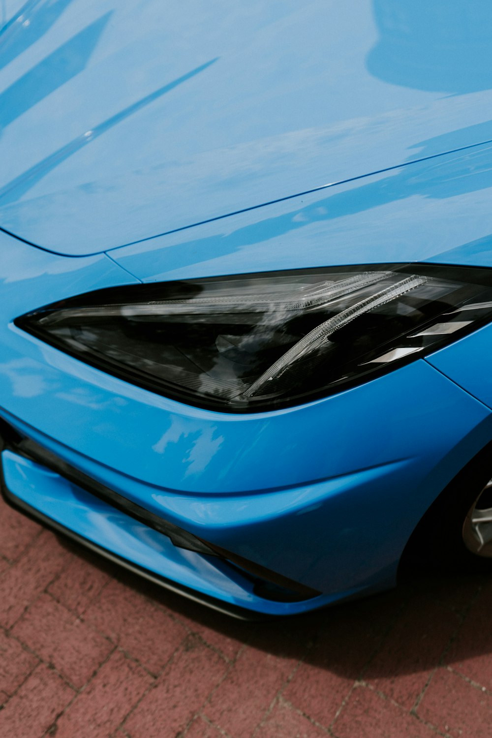 a blue car with a shiny hood