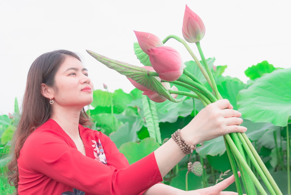 a person holding a flower