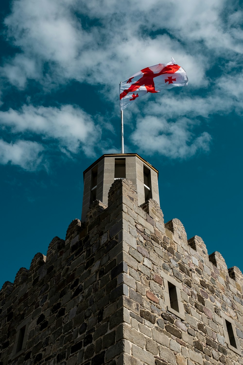 a flag flying on a building