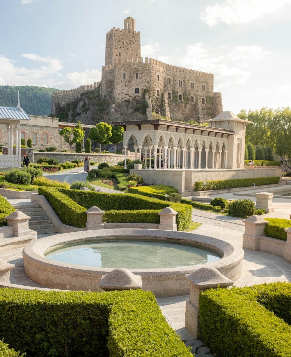 a large building with a pool in front of it