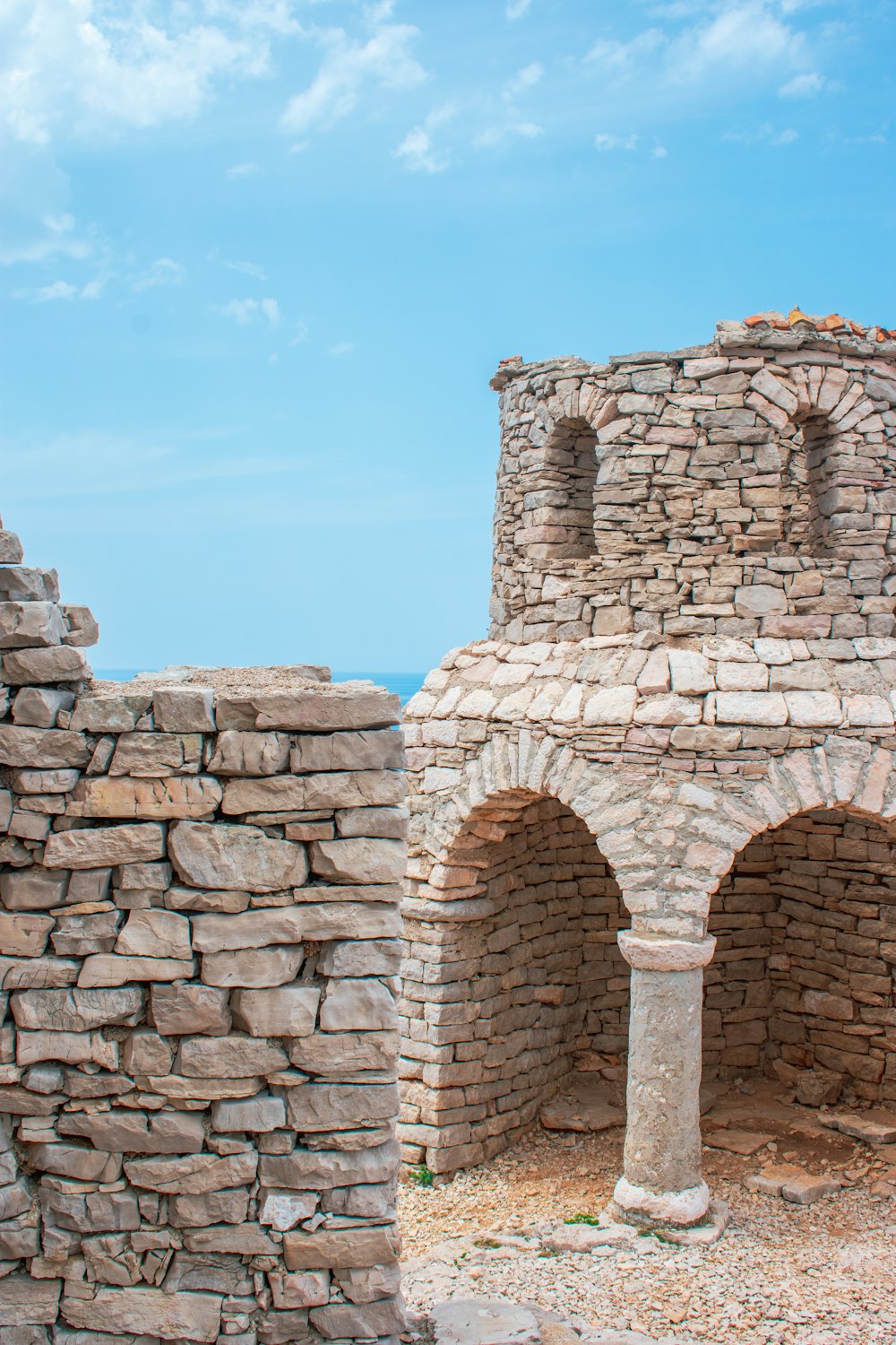 a stone archway with a stone arch