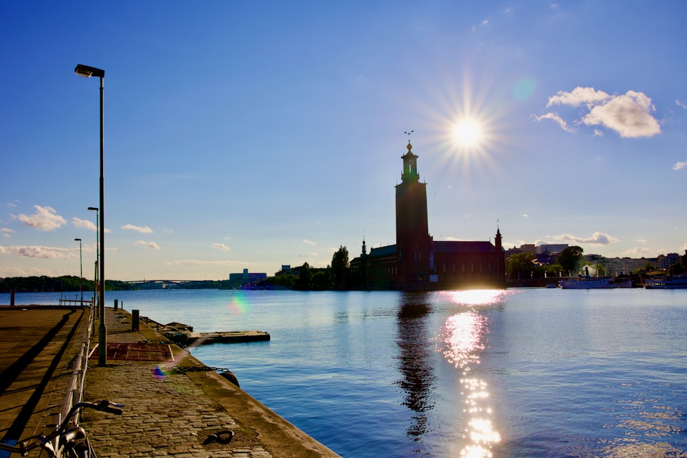 a body of water with a building in the background